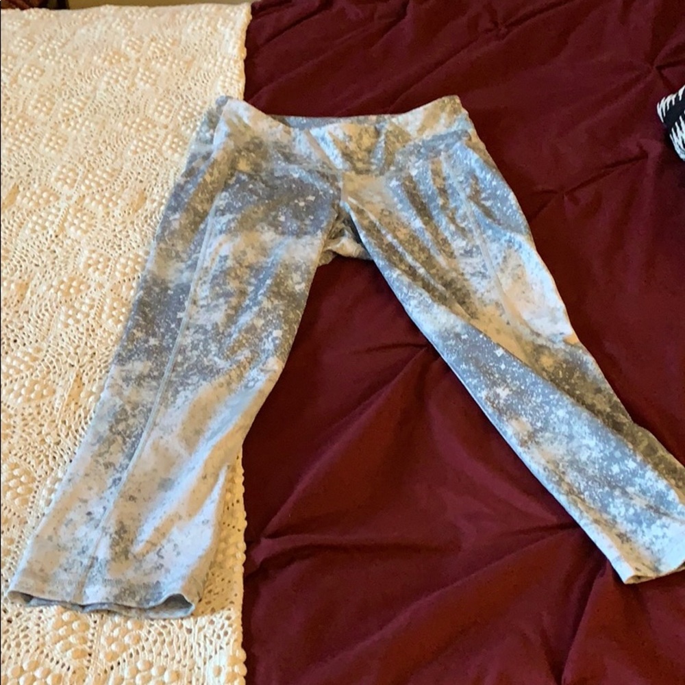 Light gray and white galaxy patterned leggings.